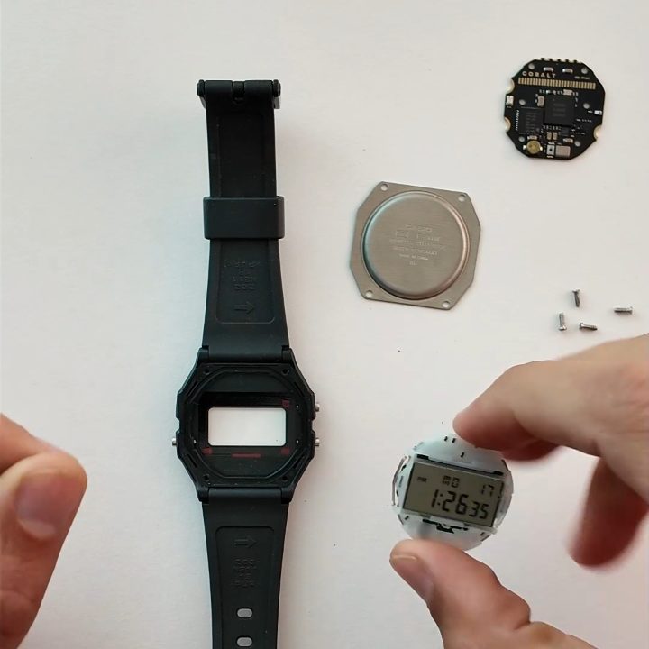 The empty case, the back, the four screws, the module with its display and the Cobalt board.