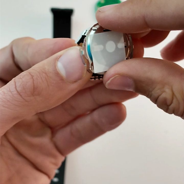 The module reassembled, with the cell back in place under its white film.